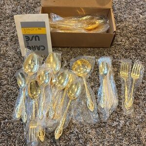 Estia pierced rose gold plated flatware. Brand new never opened. 66 piece set.